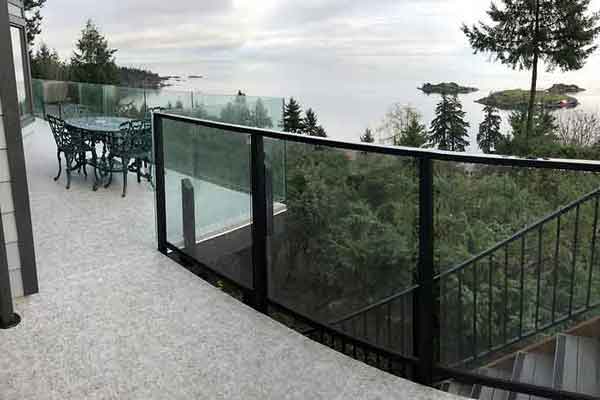 Glass rooftop railings provide weather protection and unobstructed views.