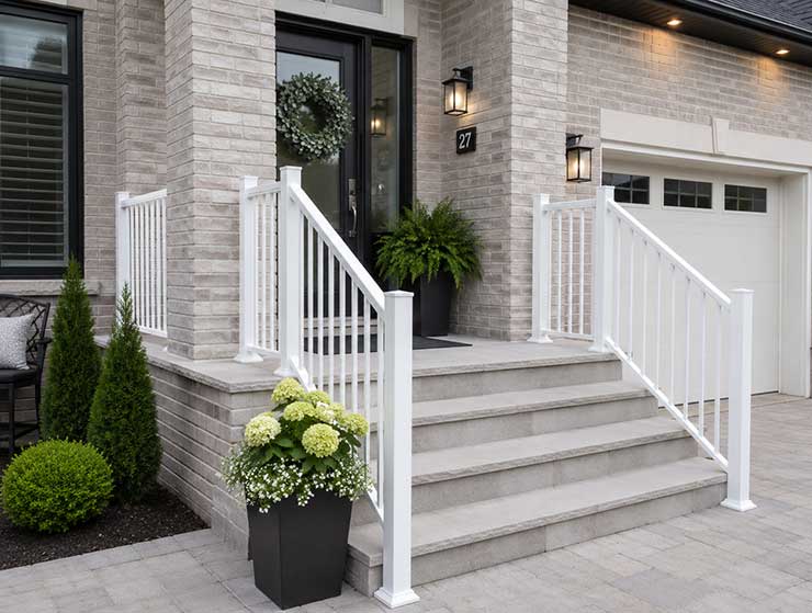 Custom porch railing installed on new home in Chatham, ON.